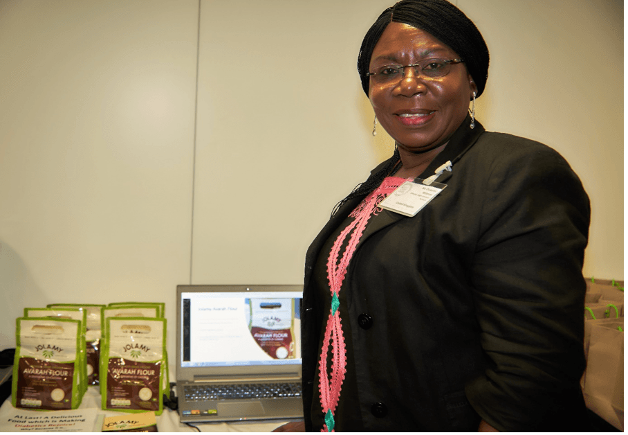 Smiling person with laptop